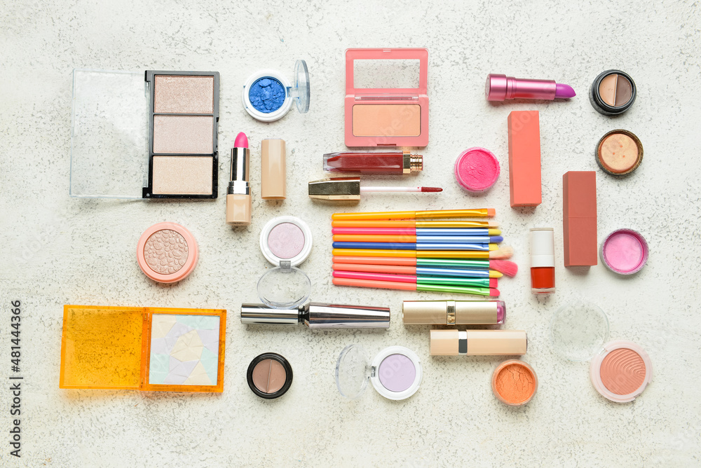 Naklejka premium Different makeup products on light background