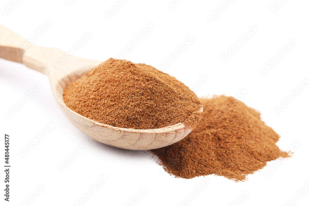 Cinnamon powder in wooden spoon isolated on white background