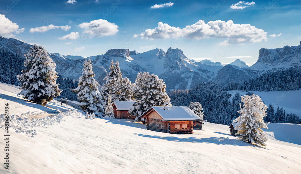 Frosty morning view of Alpe di Siusi village. Breathtaking winter landscape of Dolomite Alps. Majestic outdoor scene of ski resort, Ityaly, Europe. Beauty of nature concept background.