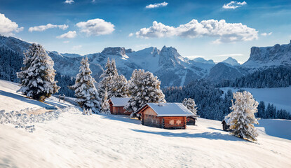 Frosty morning view of Alpe di Siusi village. Breathtaking winter landscape of Dolomite Alps. Majestic outdoor scene of ski resort, Ityaly, Europe. Beauty of nature concept background.