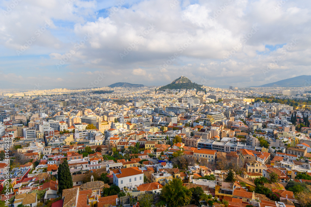 View of the Plaka and Monastiraki districts and Mount Lycabettus from the Acropolis on Acropolis Hill in Athens, Greece, on an overcast autumn day.