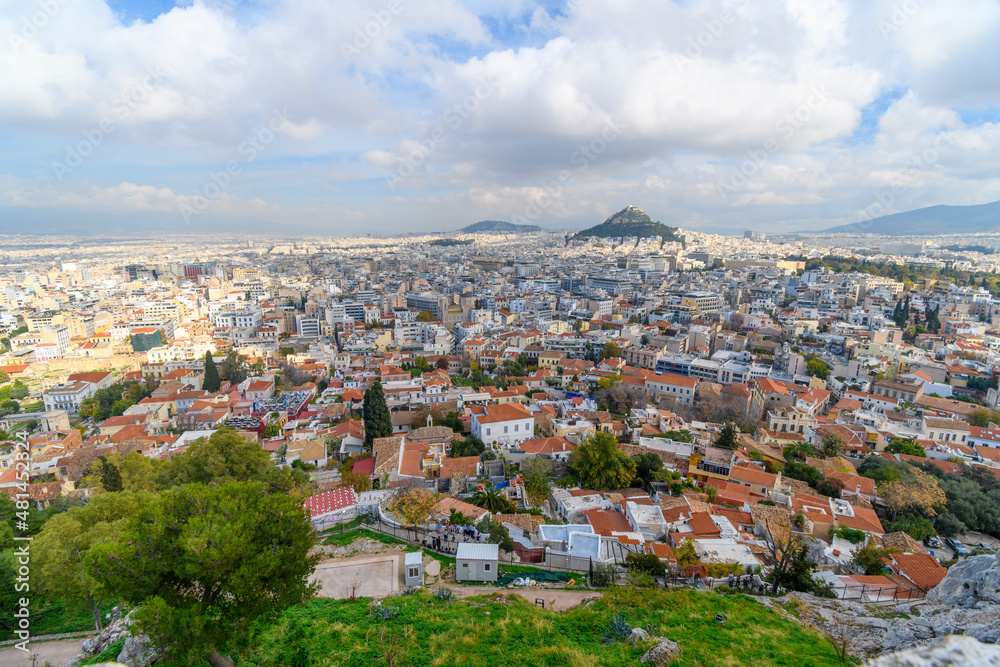 View of the Plaka and Monastiraki districts and Mount Lycabettus from the Acropolis on Acropolis Hill in Athens, Greece, on an overcast autumn day.