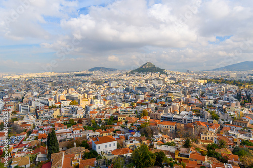 View of the Plaka and Monastiraki districts and Mount Lycabettus from the Acropolis on Acropolis Hill in Athens, Greece, on an overcast autumn day.