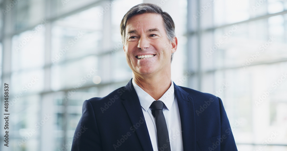 He makes his experience count. Cropped shot of a mature businessman walking through a modern office. He makes his experience count. Cropped shot of a mature businessman walking through a modern office.
