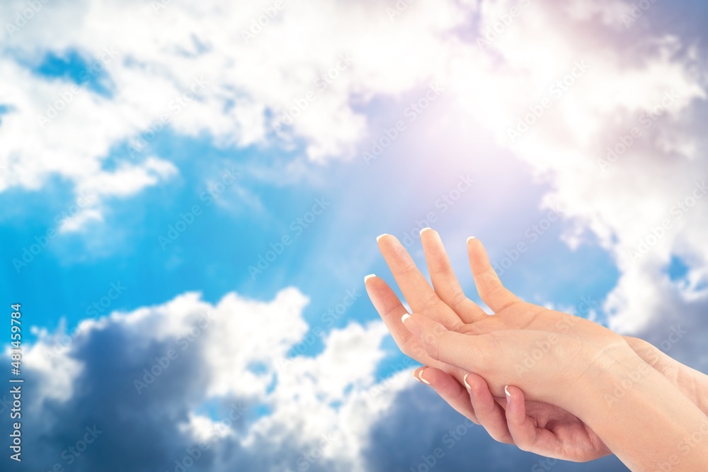 Hands of human praying on sky background with sunlight, Spirituality with believe and religion