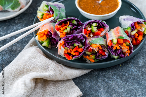 vietnamese vegetarian spring rolls with carrot, cucumber, red cabbage and spicy sauce. Healthy eating