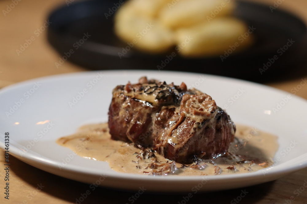 Steak with sauce on with plate Steak with sauce on with plate