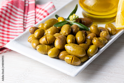 Cracked green olives. Crack...