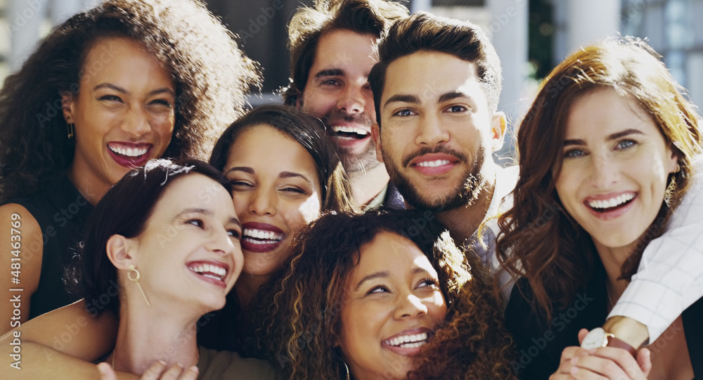 This team radiates positivity. Cropped shot of a group of happy businesspeople standing in their workplace lobby. This team radiates positivity. Cropped shot of a group of happy businesspeople standing in their workplace lobby.