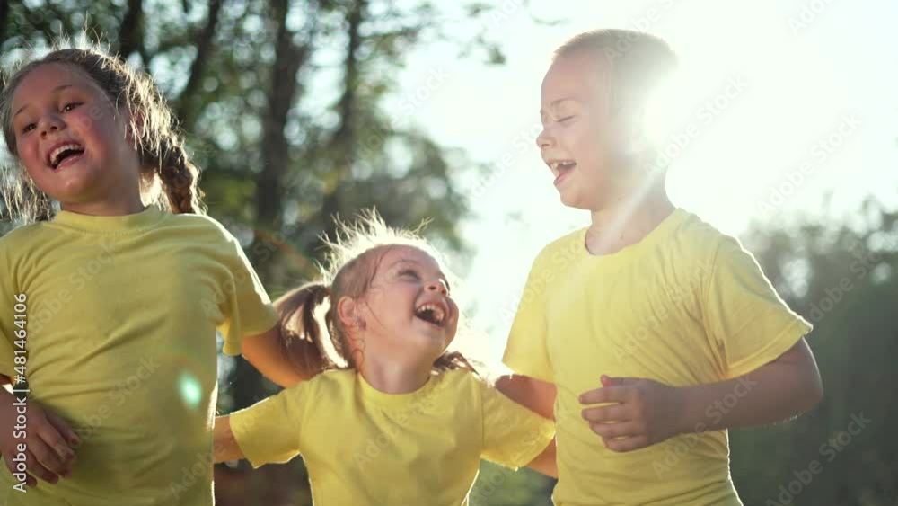 Happy family of children. Children in forest park play laughing. Happy kid smiles together for camera in forest park. Teamwork of kid. Play in forest park. Smiles of children. Happy teamwork concept. Happy family of children. Children in forest park play laughing. Happy kid smiles together for camera in forest park. Teamwork of kid. Play in forest park. Smiles of children. Happy teamwork concept.