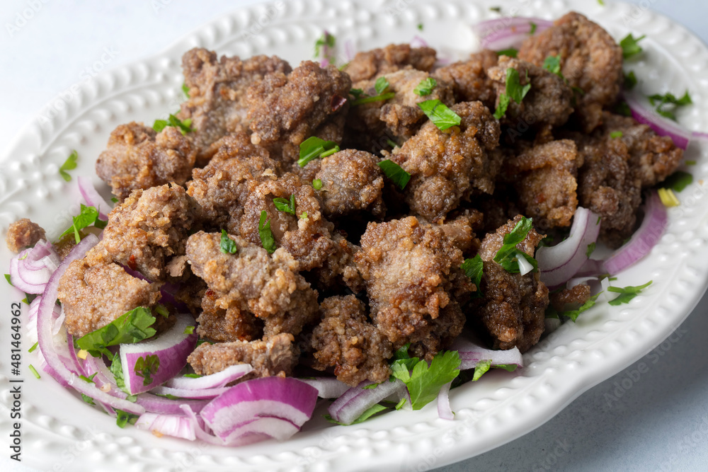 Liver pan (Albanian liver) Turkish traditional food. Liver over rice. (Turkish name; arnavut ciger) Liver pan (Albanian liver) Turkish traditional food. Liver over rice. (Turkish name; arnavut ciger)