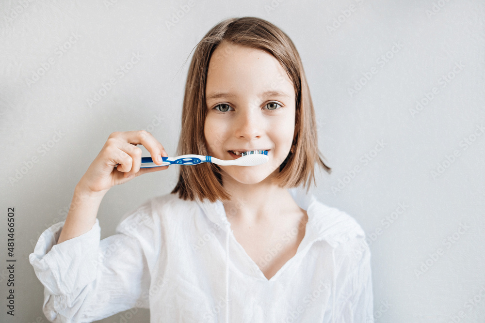 Girl brushes her teeth, dental care since childhood, a visit to the dentist Girl brushes her teeth, dental care since childhood, a visit to the dentist