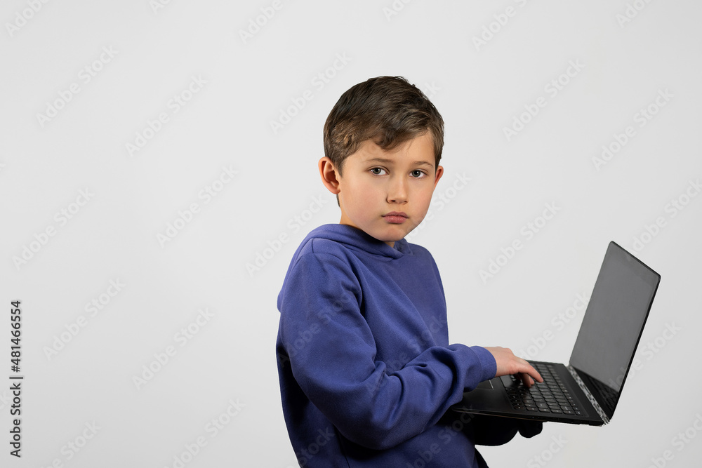 Boy on a white background with a laptop