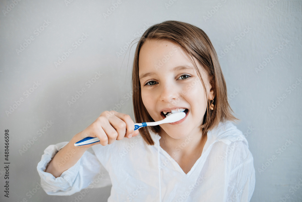 Girl brushes her teeth, dental care since childhood, a visit to the dentist Girl brushes her teeth, dental care since childhood, a visit to the dentist