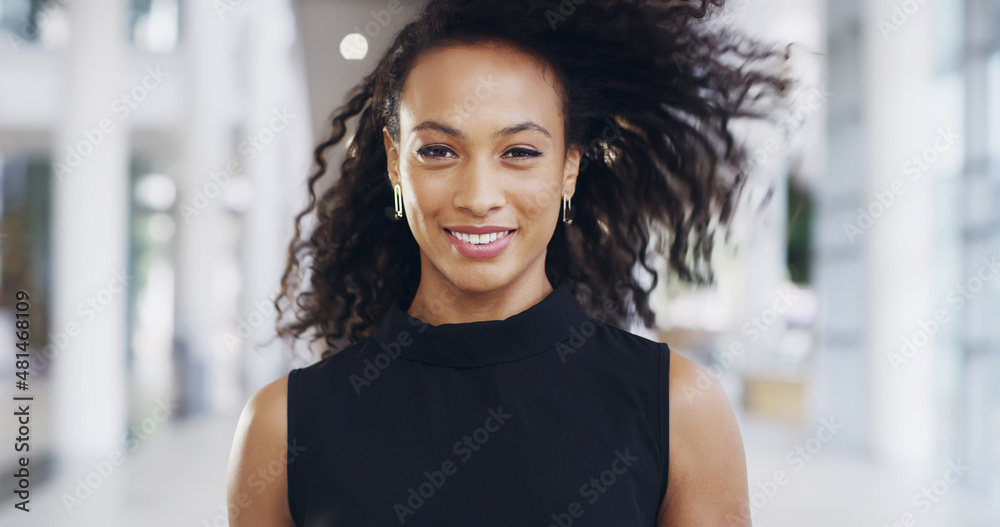 Focused on my career goals. Cropped shot of an attractive young businesswoman standing in her workplace.