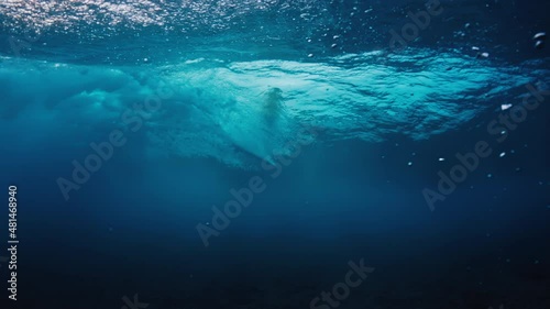 Wallpaper Mural Surfing in Maldives. Underwater view of the surfer riding the wave Torontodigital.ca