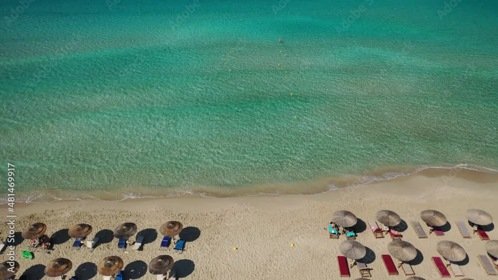 Aerial drone video of tropical paradise exotic island bay with emerald crystal clear beach visited by luxury yachts and sail boats in Caribbean destination Aerial drone video of tropical paradise exotic island bay with emerald crystal clear beach visited by luxury yachts and sail boats in Caribbean destination