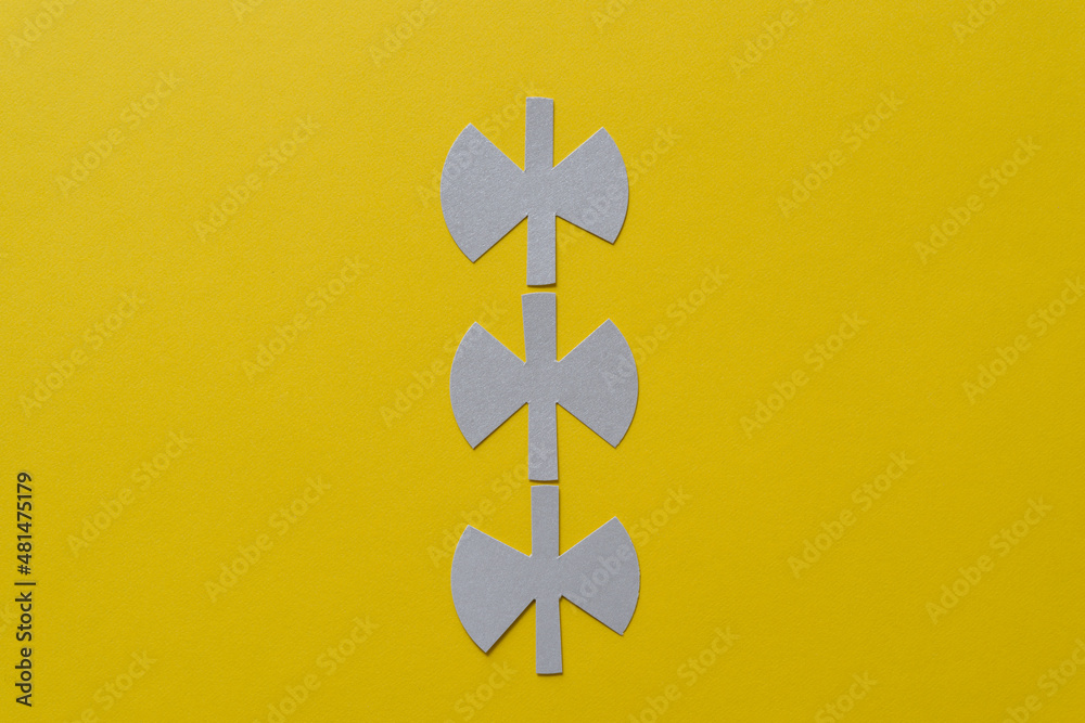 Fototapeta premium three unique paper shapes on yellow