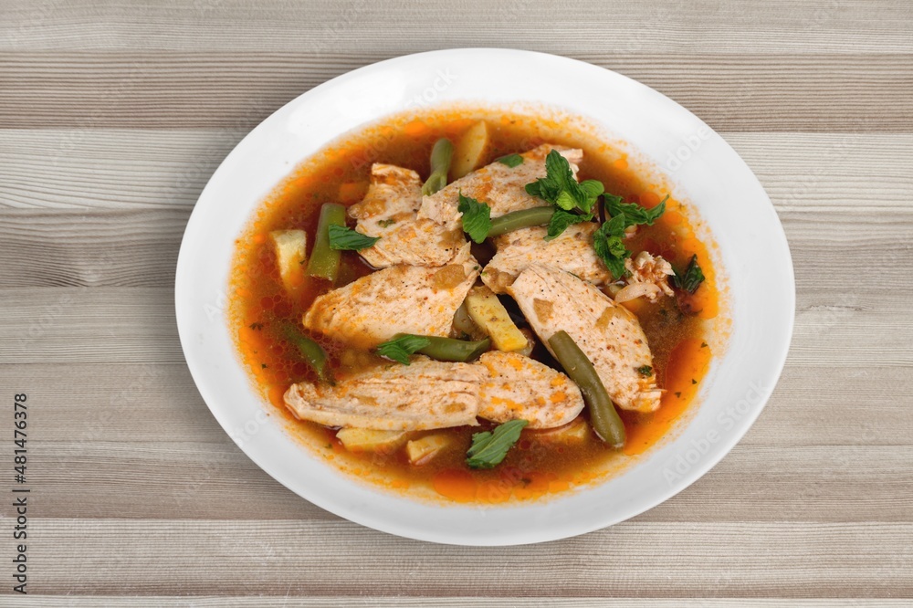 Thai dish with chicken, eggs, spicy, curry paste, tomatoes in a bowl Thai dish with chicken, eggs, spicy, curry paste, tomatoes in a bowl
