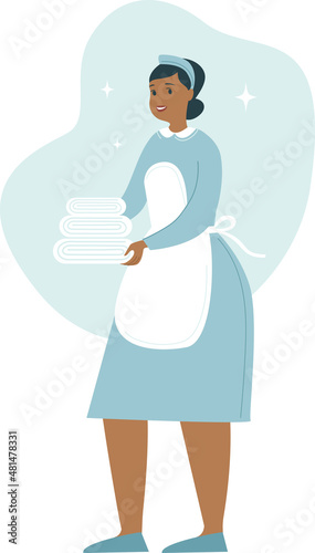 Maid Holding Towels. Housekeeper with a stack of clean linens. Cleaning service at the hotel. Woman in Housekeeping uniform.