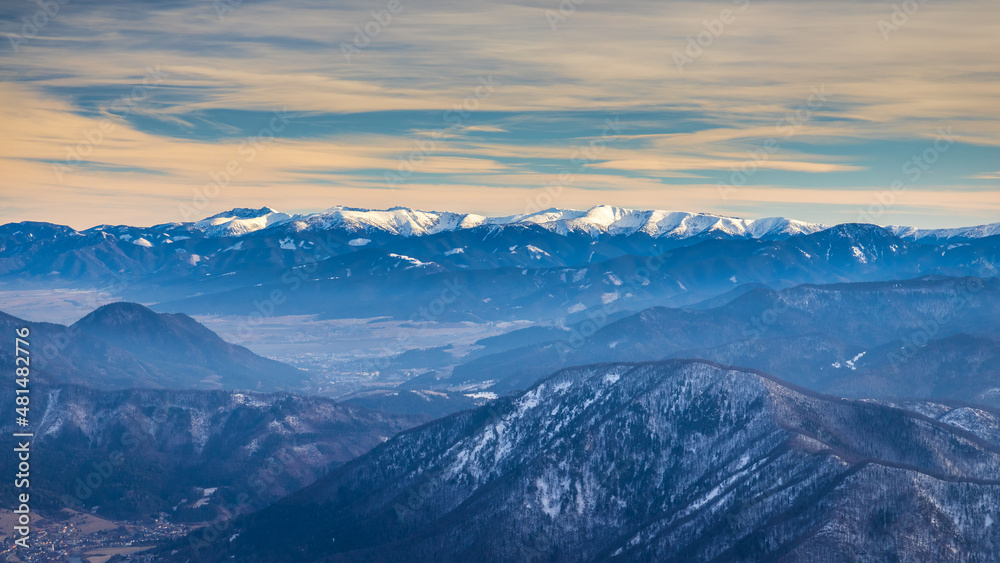 View of the winter landscape with snowy mountains of Western Tatras National Park on background, Slovakia, Europe.