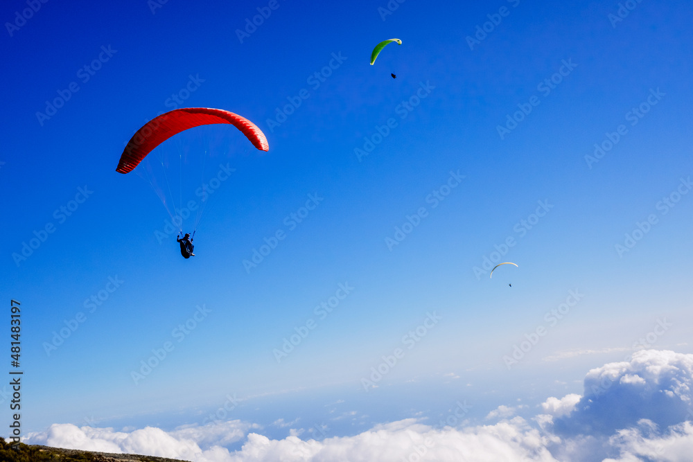 Athletes use an ultralight flexible glider, paraglider, to fly above the clouds. Athletes use an ultralight flexible glider, paraglider, to fly above the clouds.