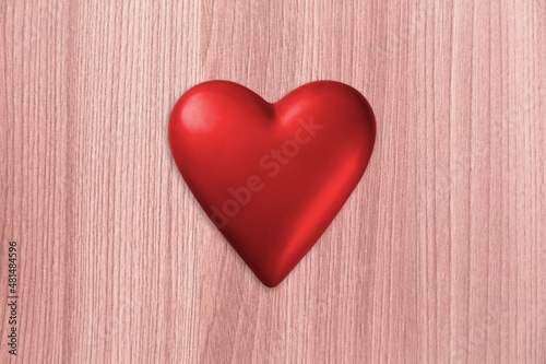 Red heart shape on pastel background
