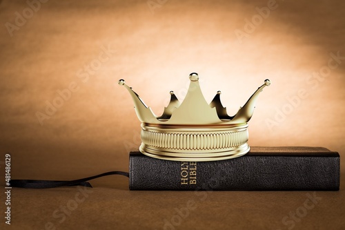 Fototapeta The Holy Bible and a Kings Crown on a desk