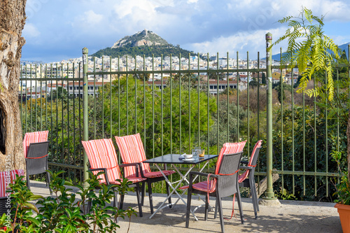 View of Mount Lycabettus from a sidewalk cafe table in the Monastiraki district of Athens, Greece. photo