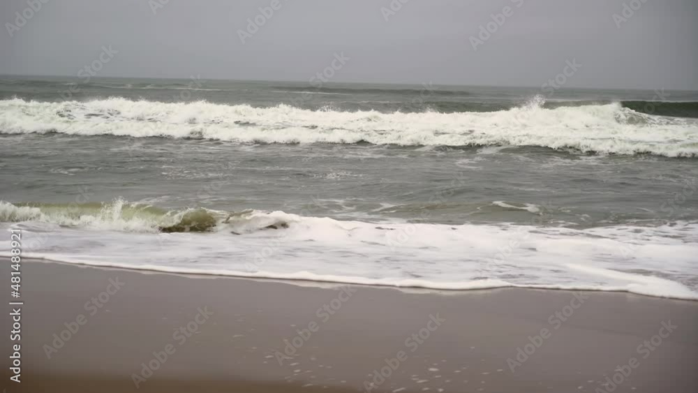 Atlantic ocean, sea strong waves and surf. Sandy wild beach, storm. Atlantic ocean, sea strong waves and surf. Sandy wild beach, storm.