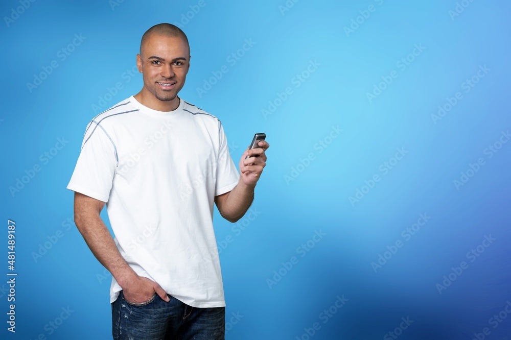 Young man typing sms, internet concept, high speed internet on phone Young man typing sms, internet concept, high speed internet on phone