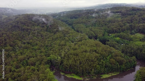 Flight over hills with clouds 