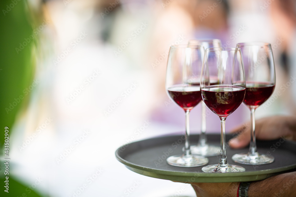 red wine glass with bokeh background, enjoy party, drink don't drive concept. celebration party