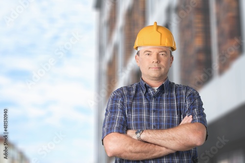 Male engineer handsome man or architect looking construction with safety helmet