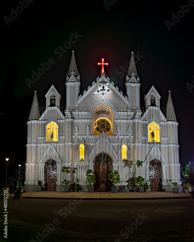 More than 160 years old magnificent structure and an iconic landmark in the city - Saint Patrick’s Cathedral, Pune, Maharashtra, India. Here it is specially illuminated on Christmas eve. photo