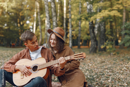 Beautiful couple spend time in a autumn park © hetmanstock2