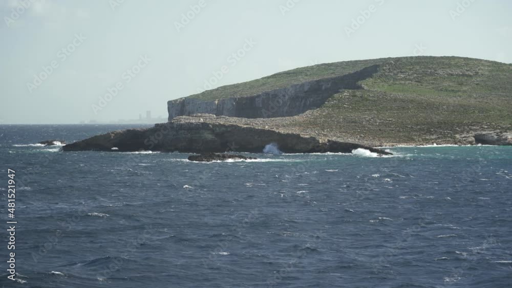 Mediterranean Sea Washes Comino Island Shores During Winter on Sunny and Windy Day Mediterranean Sea Washes Comino Island Shores During Winter on Sunny and Windy Day