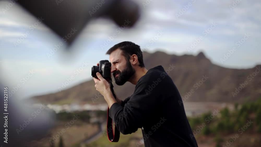 Bearded photographer clicking landscapes with prime lens at Teide national park Bearded photographer clicking landscapes with prime lens at Teide national park