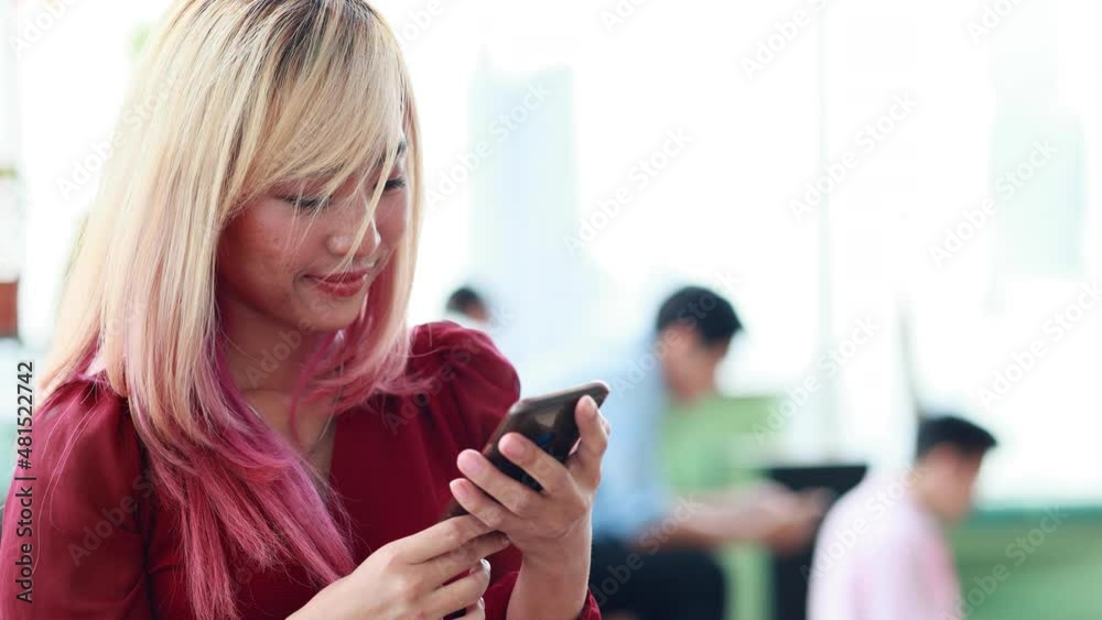Portrait young beautiful hipster woman using smart phone. Business woman working in modern office. Portrait young beautiful hipster woman using smart phone. Business woman working in modern office.