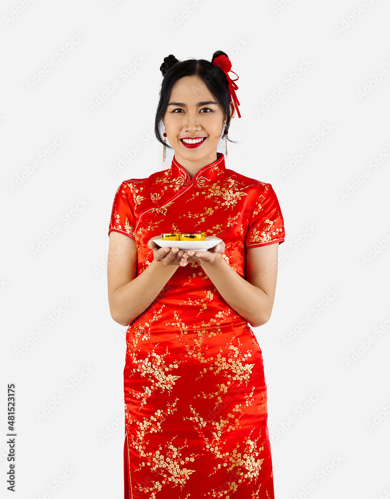 Chinese new year concept. Asian woman in red traditional oriental costume holding plate of teas isolated on white background. Chinese new year concept. Asian woman in red traditional oriental costume holding plate of teas isolated on white background.