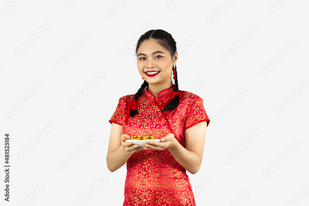 Asian girln holding plate of teas in red traditional oriental costume isolated on white background. Chinese new year concept style. Asian girln holding plate of teas in red traditional oriental costume isolated on white background. Chinese new year concept style.