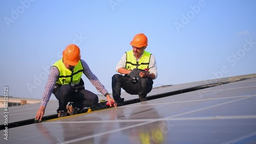 Wallpaper Mural Engineer wearing unifrom and helmet inspect and check solar cell panel ,solar cell is ecology energy sunlight power installation for industrail ,alternative environment power concept.	
 Torontodigital.ca
