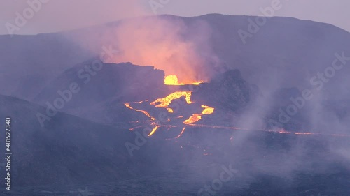 4k and slowmotion shots of the icelandic volcano erupting. photo
