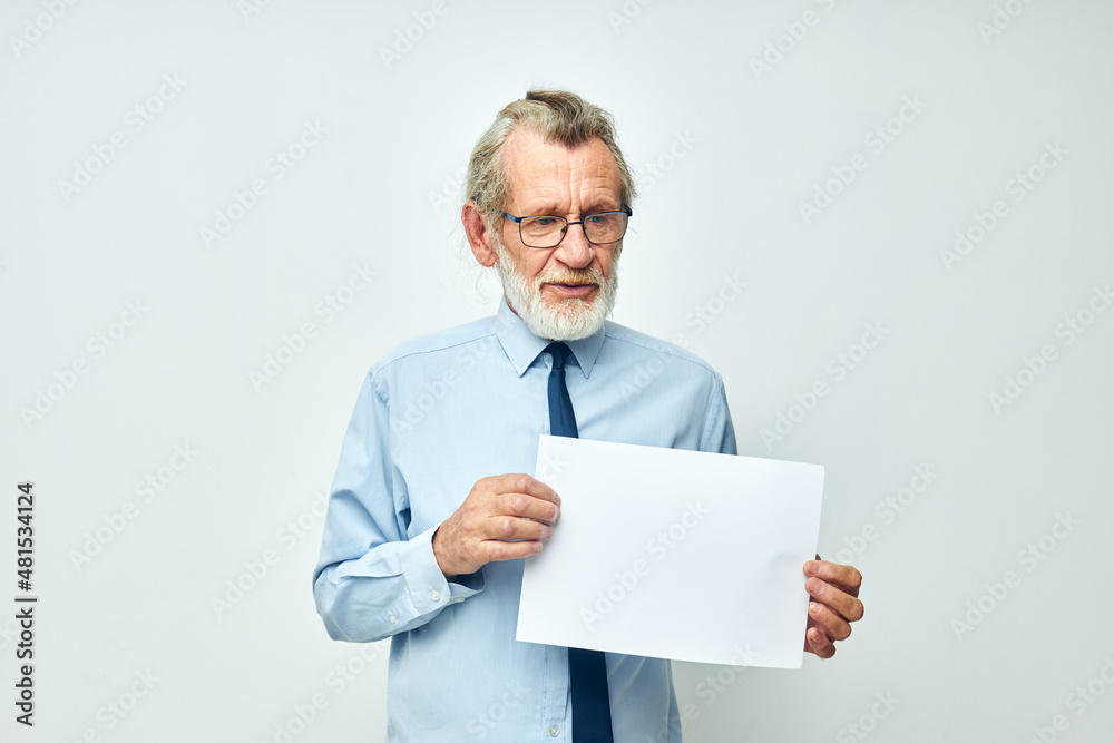 Portrait of happy senior man work office blank sheet of paper light background Portrait of happy senior man work office blank sheet of paper light background