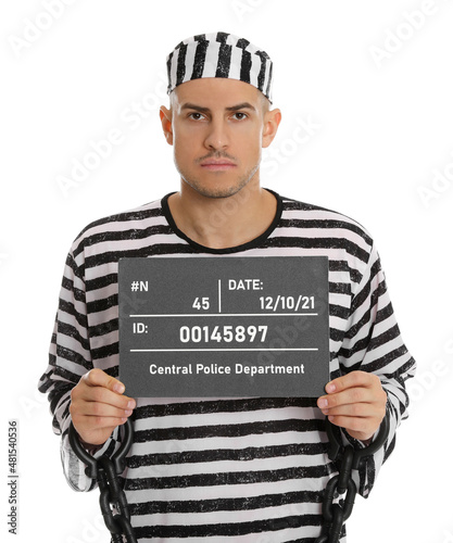 Billede på lærred Mug shot of prisoner in striped uniform with board on white background, front vi