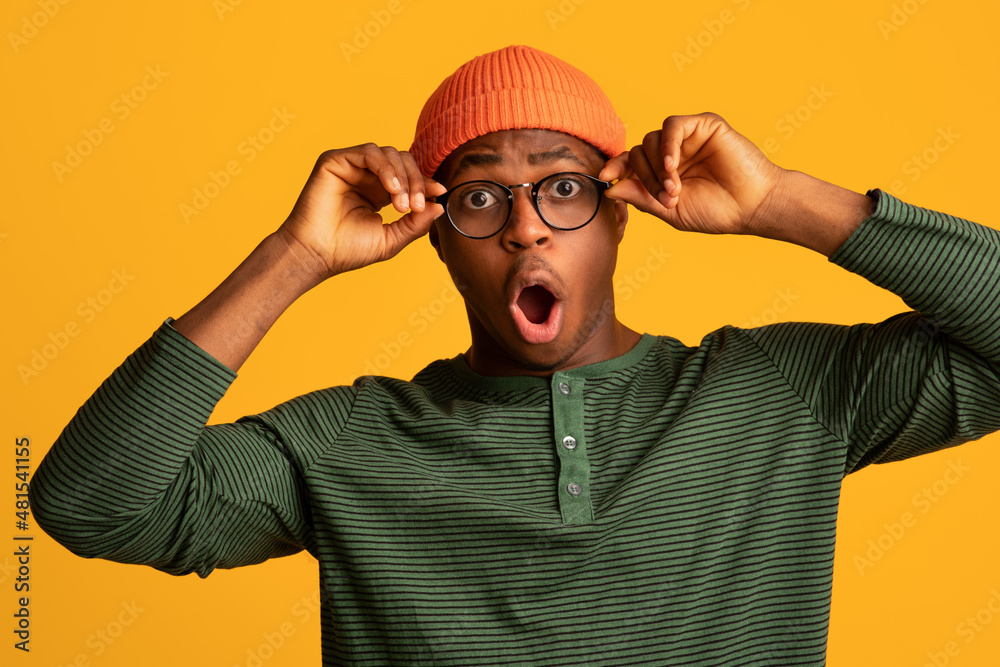 Amazed Shocked Young Black Guy Touching Glasses And Opening Mouth In Surprise Amazed Shocked Young Black Guy Touching Glasses And Opening Mouth In Surprise