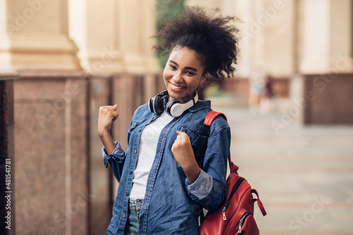 Cheerful African Student Girl Celebrating Passed Exam Gesturing Yes Outside photo