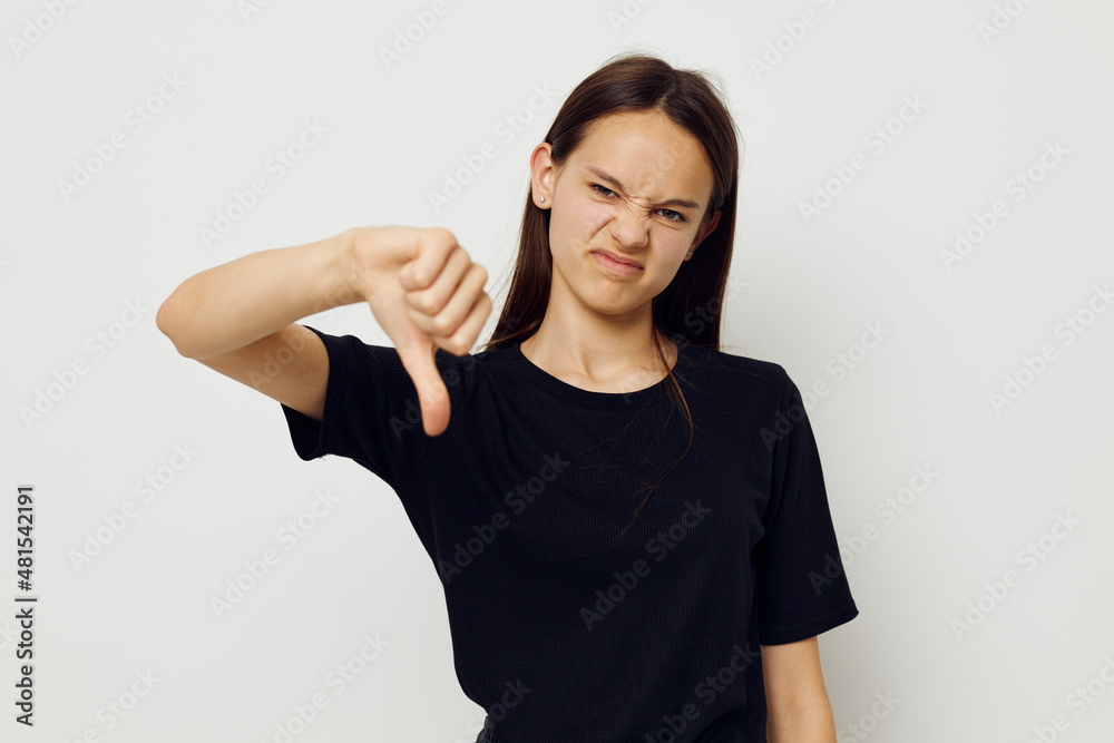 beautiful girl in a black t-shirt hand gesture fun isolated background beautiful girl in a black t-shirt hand gesture fun isolated background