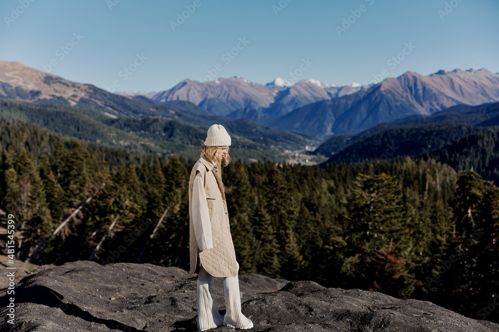 woman Standing on the edge of a cliff nature travel landscape woman Standing on the edge of a cliff nature travel landscape
