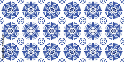 Tile background in blue. Vector seamless repeat of hand drawn blue flowers. 